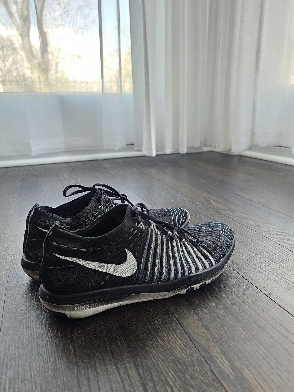 Nike Women's Black And Blue Flyknit Running Shoes